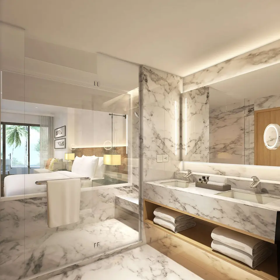 et badeværelse med marmor bordplader og stort spil i Hilton Resort Hua Hin